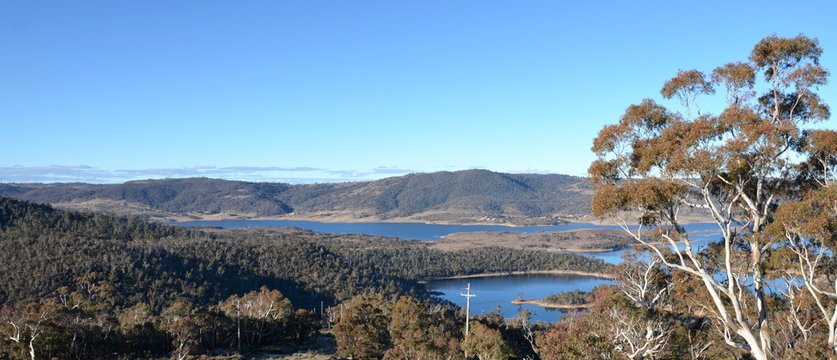 Broad panorama of the countryside in New South Wales and Lake Jindabyne. View from Kosciusko Rd.