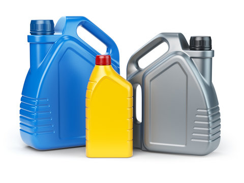 Different types of plastic canisters of motor oil on white isolated background.