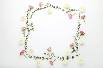 Rose flowers and stems with green leafs on white background
