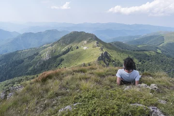 Foto op Canvas Beautiful girl in the mountains. An incredible view of the Troyan Balkan. The mountain captivates with its beauty, fresh air, a sense of infinity, coziness and tranquility. © Petko