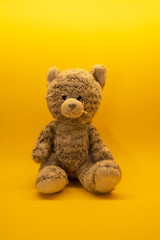 Cute teddy bear toy on background with copy space