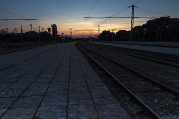 Fototapeta na wymiar Summer sunset from a railway station.