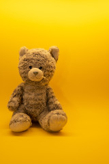 Cute teddy bear toy on background with copy space