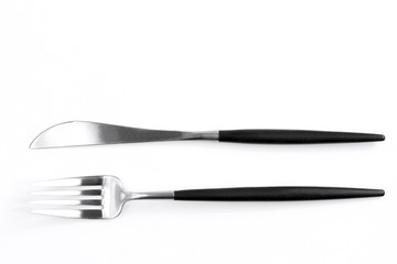 Knife and fork on white background