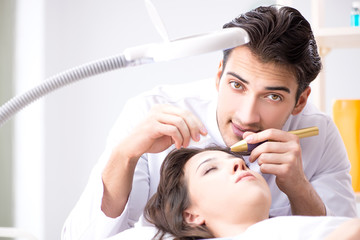 Naklejka premium Woman visiting dermatologyst for laser scar removal