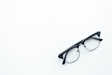 Top view glasses black on white table with copy space