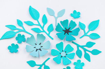 Fototapeta na wymiar Flower and leaf of blue color made of paper