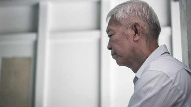 Asian senior elderly man worry about health medication fee at hospital