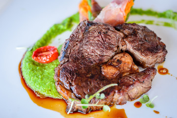 Grilled sirloin steak on white porcelain plate