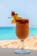 Tropical cold drink outside with blue ocean water