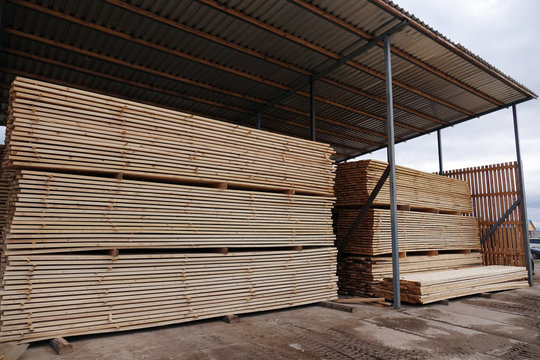 Plant for the production of wood boards. Pilorama. The concept of production, manufacturing and woodworking.