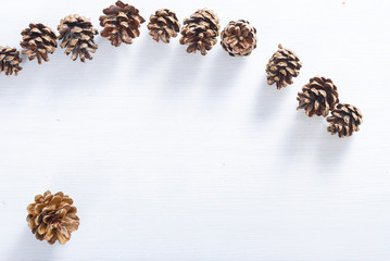 pine cones on white wood table, purity Christmas decoration