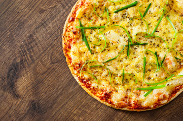 Pizza Margherita or Margarita with Mozzarella cheese. Italian pizza on wooden background