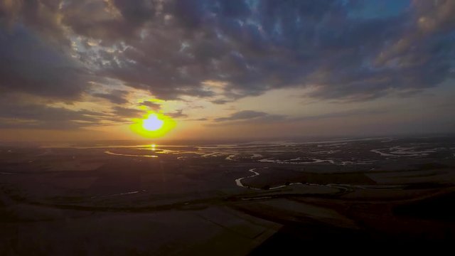 Landing on the background of the setting sun