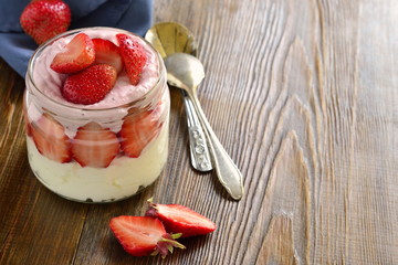 Cottage cheese with strawberries in a jar. Healthy nutrition, copy space