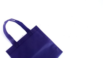 Purple cloth bag.white background....Nowadays, most people use cloth bags instead of plastic...