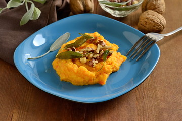 Corn porridge / polenta / with roasted carrots, walnuts and sage