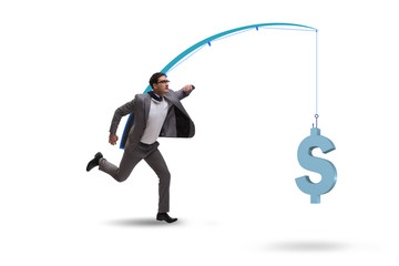 Businessman chasing money on fishing rod
