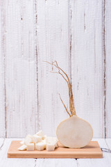 Tasty and useful turnip on wooden background