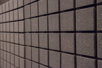 Background of foam panels for sound insulation in the studio