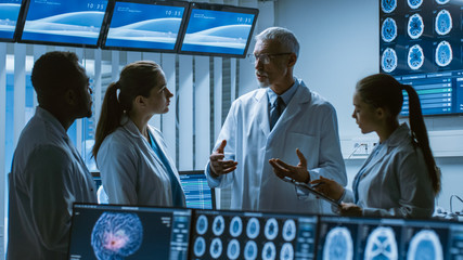 Meeting of the Team of Scientists in the Brain Research Laboratory. Neurologists / Neuroscientists Having Medical Discussion Surrounded by Monitors Showing CT, MRI Scans. - obrazy, fototapety, plakaty