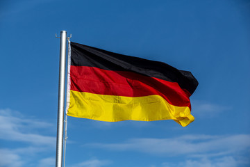 German flag against blue sky