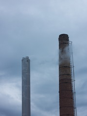industrial chimneys smoking polluting air