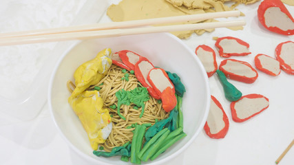 Egg noodle with dumpling, pork red sauce, vegetable molding clay Chinese food of creativity activity hobbies