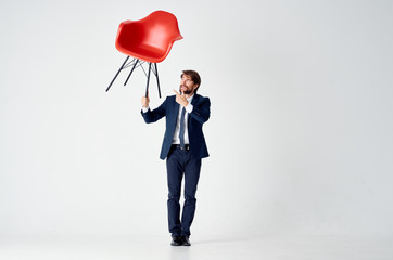 business man holding a chair