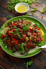 Lentil salad with roasted red pepper, zucchini and dry tomatoes, lemon. healthy food, vegetarian and vegan style