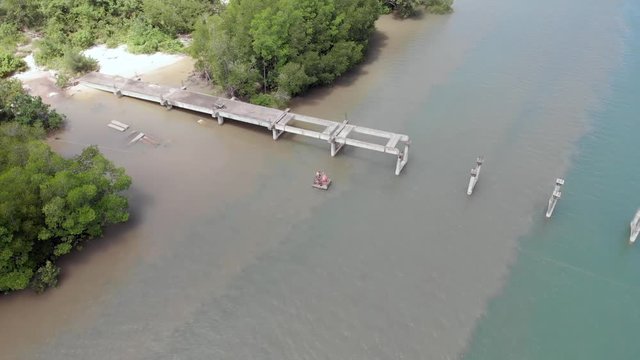 Crossing the river below the demolished bridge. Aerial shot.