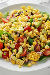 Sweet Corn salad with tomatoes, avocado, red onion, herbs and lime