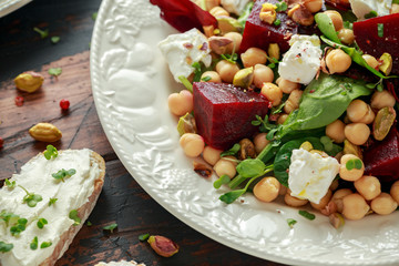 Healthy Beet Salad with chickpeas, pistachios nuts, feta and melted cheese toast