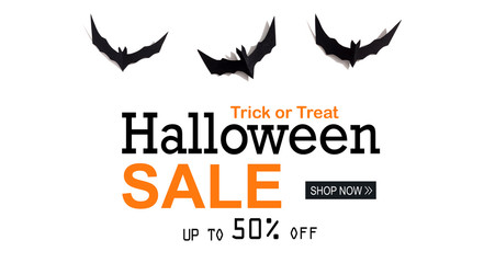 Halloween Sale message with paper bats overhead view on a solid color