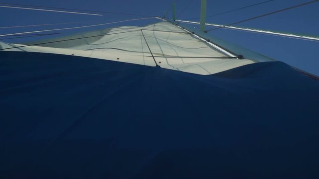 Sail going down on a monohull yacht in Australia