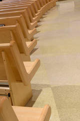 Fototapeta na wymiar row of church benches set in a curve