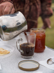 Coffee is poured into a glass