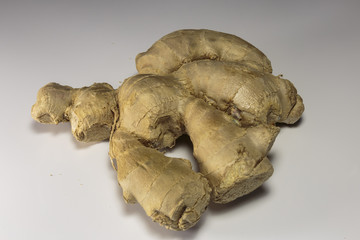 Fototapeta premium Ginger root on a white background, Asian food and popular Asian spice.