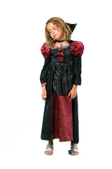 A full-length shot of a Kid dressed as a vampire at halloween holidays unhappy and frustrated with something. Negative facial expression isolated on white