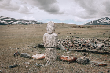Mongolian Altai. Scenic view of the turkic stone warrior (kurgan stelae or balbal) against the...