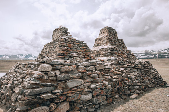 Turkic memorial structures. Turkic Stone Mens; two long lines of balbal extending toward Khurgan Lake. Nature and travel. Mongolia, Bayan-Olgii Province, Altai Tavan Bogd NP, Shar Bulag