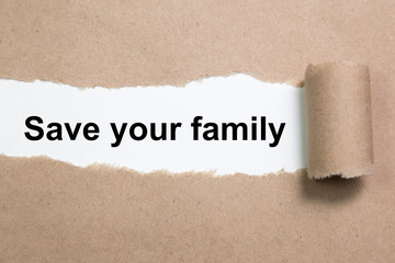Save your family text on paper. Word Save your family on a piece of paper. Concept Image.