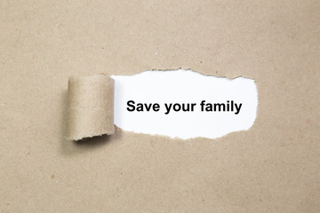 Save your family text on paper. Word Save your family on a piece of paper. Concept Image.