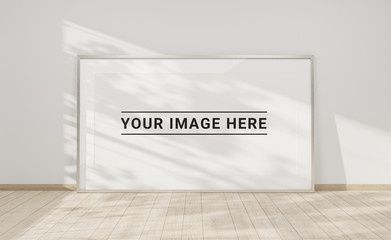 Large horizontal frame leaning on a white wall 3D rendering