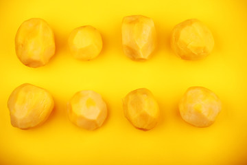 cleaned potato studio yellow background 