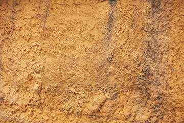 Yellow grunge cement wall background