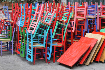 Fototapeta na wymiar Colorful chairs and tables on a cafe restaurant