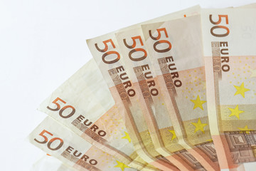 50 euro banknotes on white wooden background