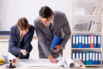 Man and woman discussing construction project
