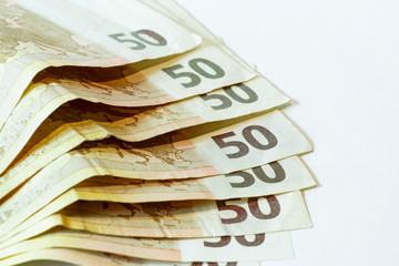 50 euro banknotes on white wooden background